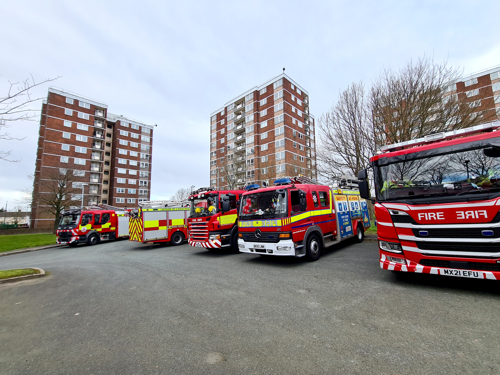 Fire engines from north west fire and rescue services parked at Gaywood Green tower blocks in Kirkby