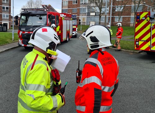 MFRS and GMFRS senior officers discuss the training exercise