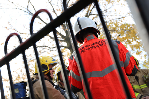 An Incident Commander from Greater Manchester Fire & Rescue Service briefing firefighters