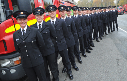 Firefighters in Development from recruit course 02/22 lined up at the side of a fire engine at the Training & Development Academy in Croxteth.